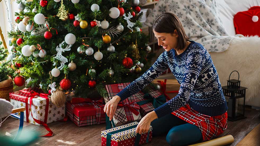 Christmas to do list woman wrapping Christmas presents